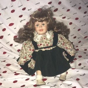 Porcelain doll sitting 9” tall 💕